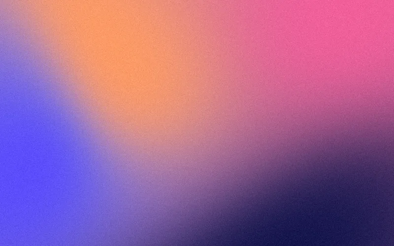 Mesh gradient shader preview: Four colours folding into one another, finished with fine grain.